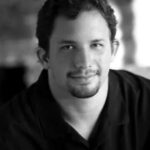 Black and white headshot of Cody Goulder